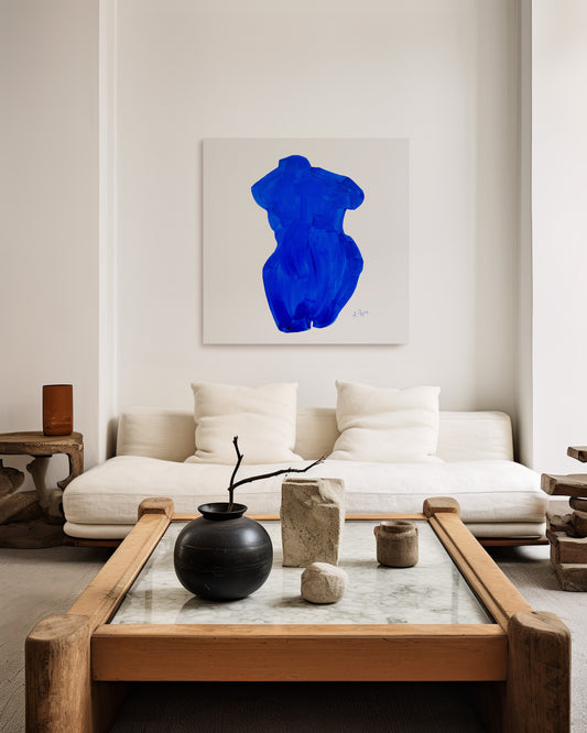 Modern living room with a white sofa, wooden coffee table, and abstract blue artwork on the wall. large canvas, acrylic on canvas, oversized wall art, abstract art, Anna Pepe, forn Studio