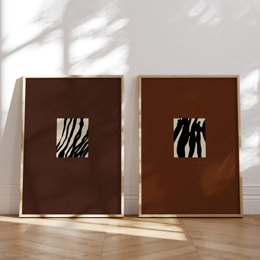 Two framed artworks by Anna pepe on a white wall.