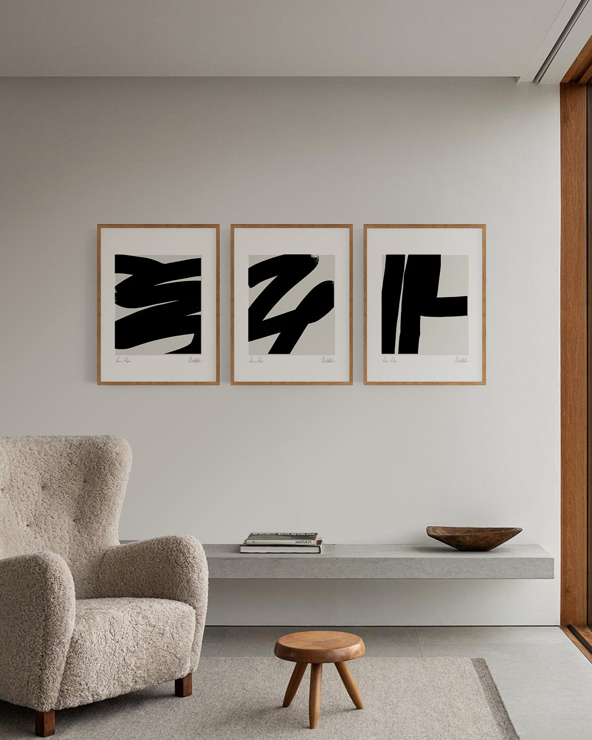 Modern living room with abstract art on the wall and a textured armchair. anna pepe, artist, contemporary art, printed wall art, framed prints, modern interior decor