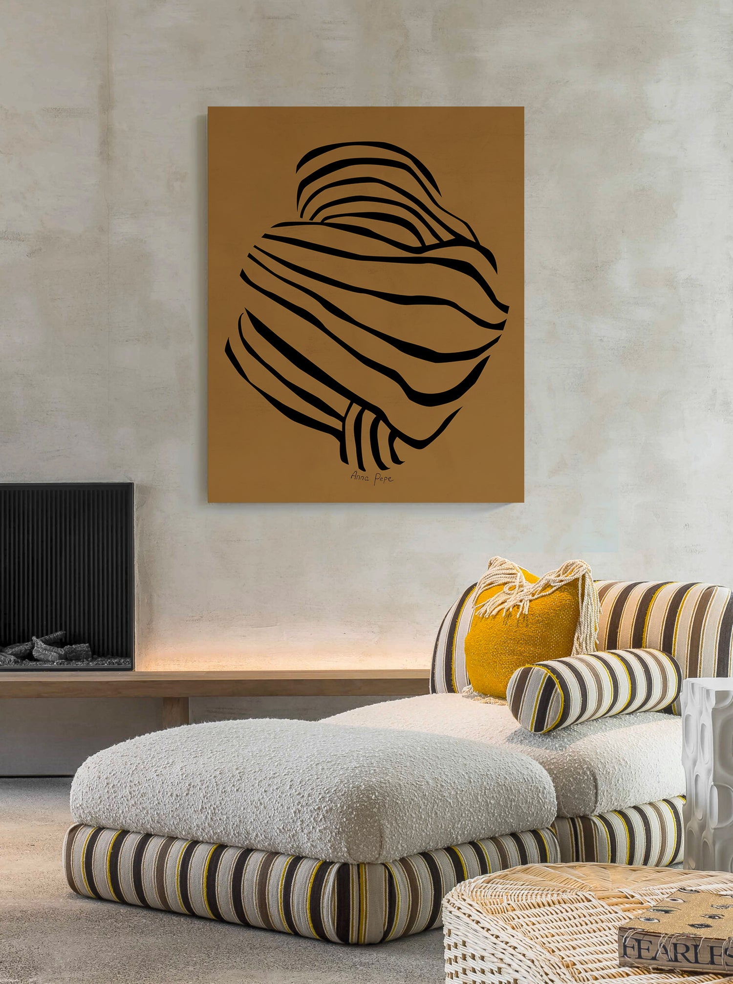 Abstract art piece on a wall above a modern living room setup.