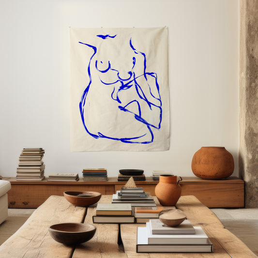 Living room with a coffee table, books, and a wall tapestry of a blue abstract figure. large canvas, acrylic on canvas, oversized wall art, abstract art, Anna Pepe, forn Studio