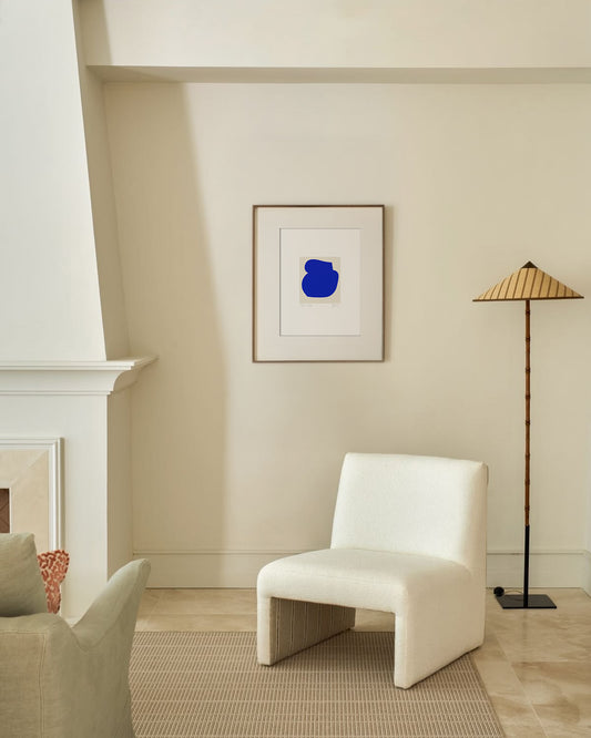 Modern living room with a white chair, beige walls, and a blue abstract painting. artist anna pepe, forn studio, abstract painting, small art work, female abstract form