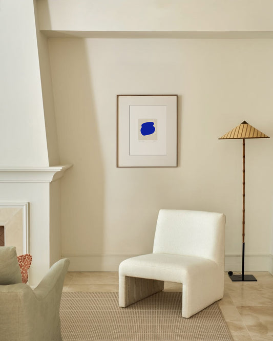 White chair in a room with a blue abstract painting on the wall. artist anna pepe, forn studio, abstract painting, small art work, female abstract form