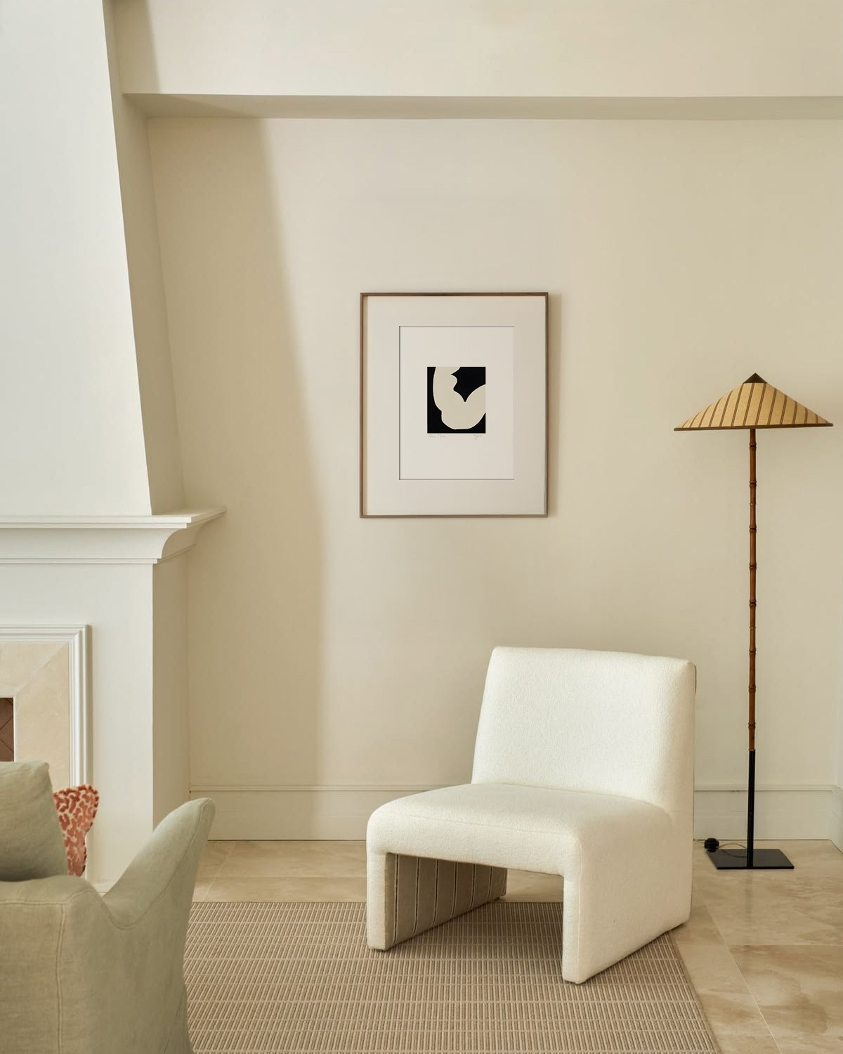 White chair in a room with a blue abstract painting on the wall. artist anna pepe, forn studio, abstract painting, small art work, female abstract form