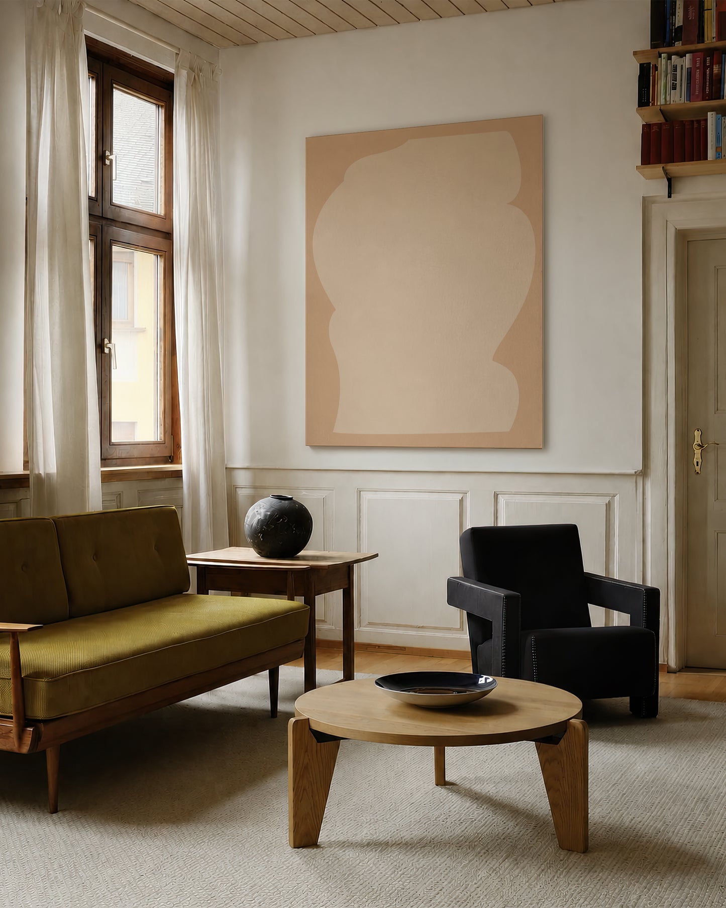 A modern living room featuring a large abstract art print on the wall, a green velvet sofa, a black armchair, and a round wooden coffee table. large canvas, acrylic on canvas, oversized wall art, abstract art, Anna Pepe, forn Studio