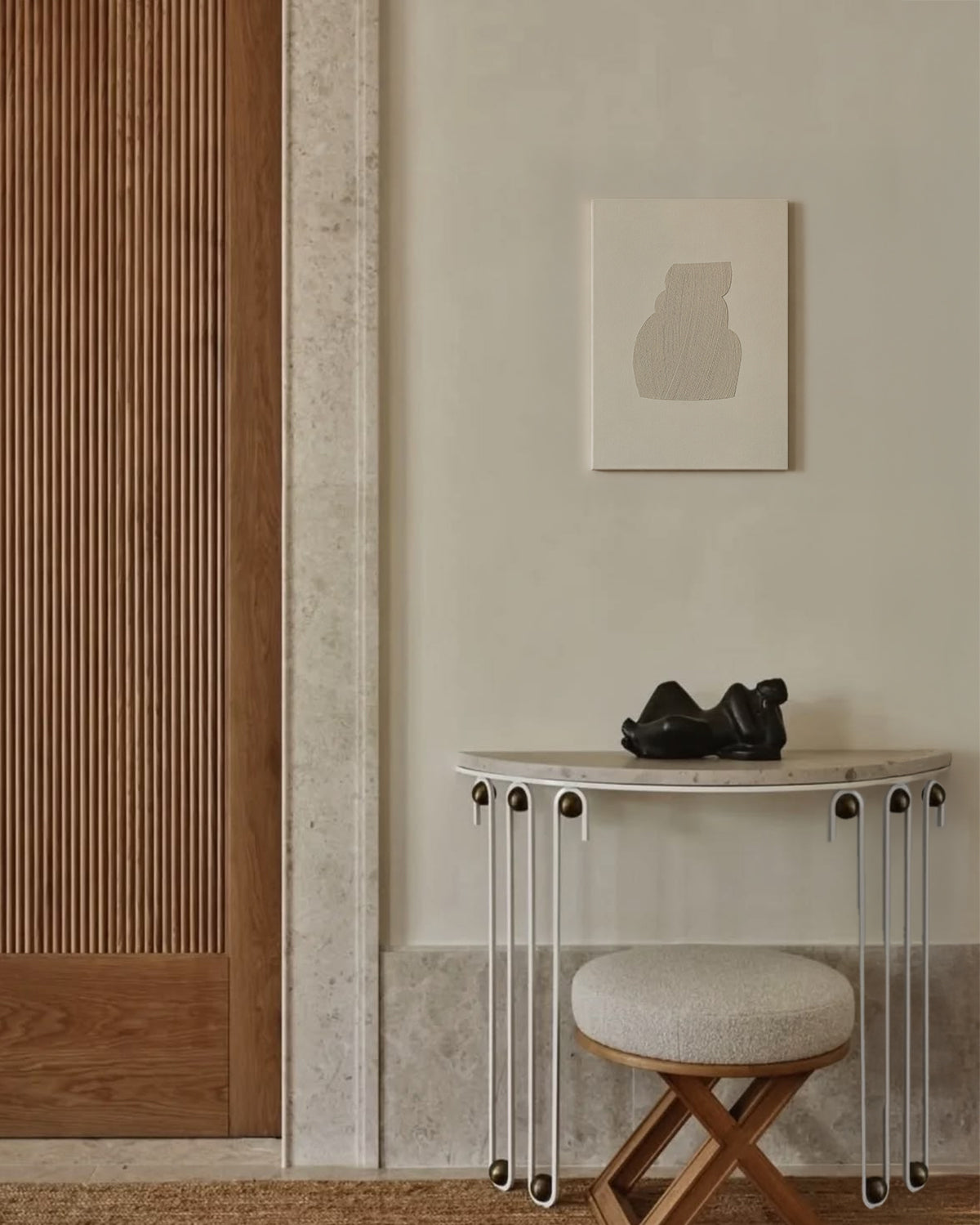 Modern interior with a half-moon console table, stool, and abstract art on the wall. artist anna pepe, forn studio, abstract painting, small art work, female abstract form
