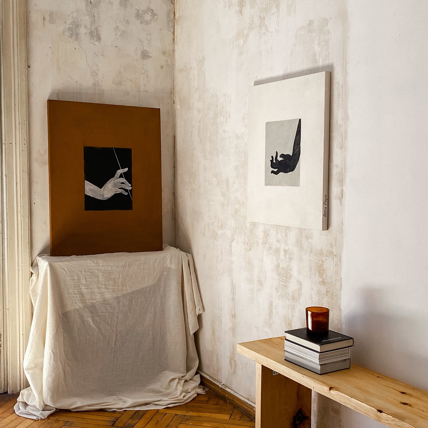 An interior room corner with two framed art prints hanging on textured off-white walls. large canvas, acrylic on canvas, oversized wall art, abstract art, Anna Pepe, forn Studio