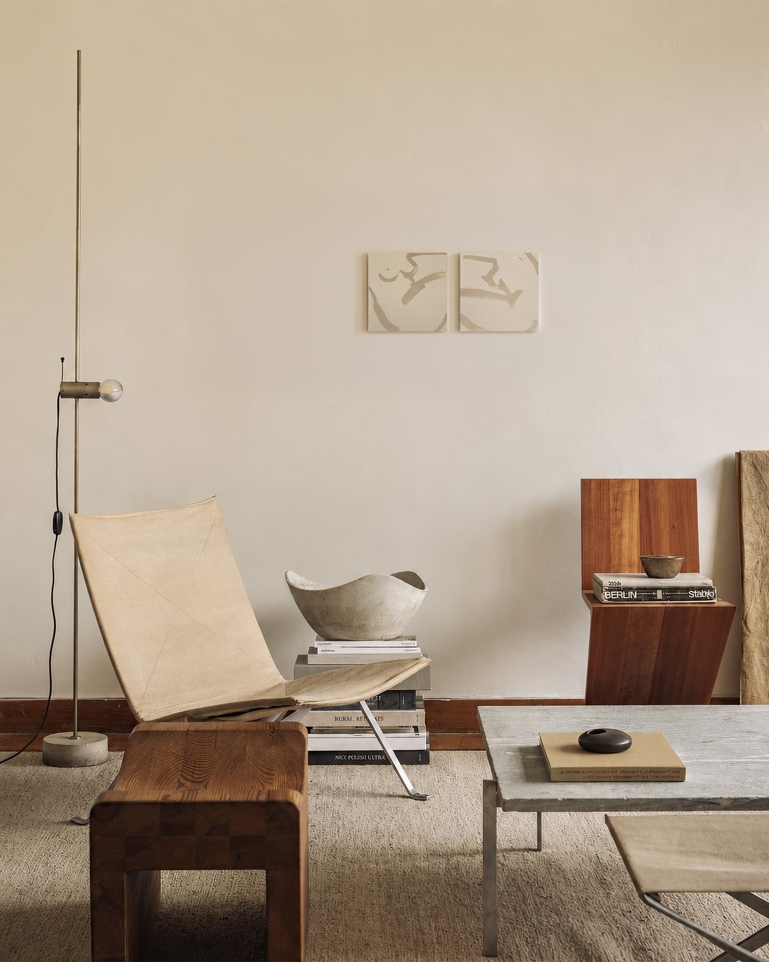 Modern living room with wooden furniture, a coffee table, and wall art. Anna Pepe, forn Studio, unprimed canvas, set of two, small format wall art