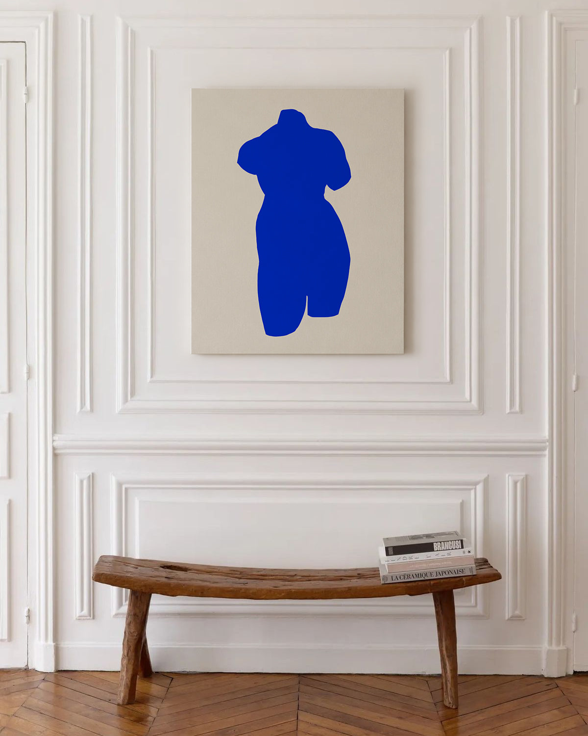 Blue abstract sculpture on a beige wall above a wooden bench. large canvas, acrylic on canvas, oversized wall art, abstract art, Anna Pepe, forn Studio
